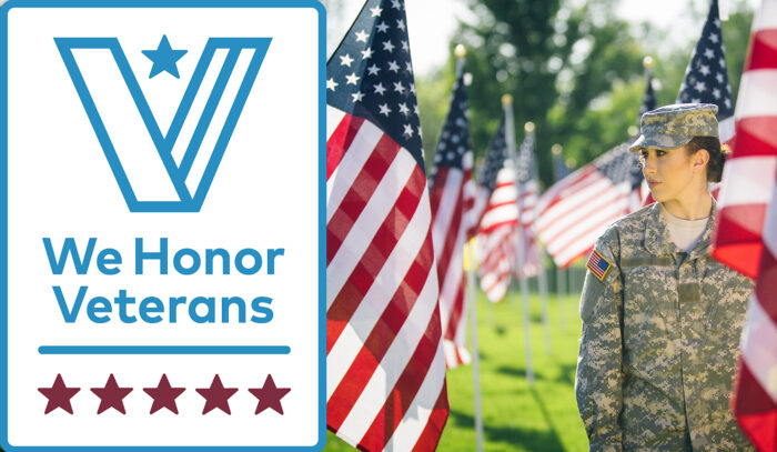 Beautiful Hispanic American soldier in Uniform standing in front of American flags